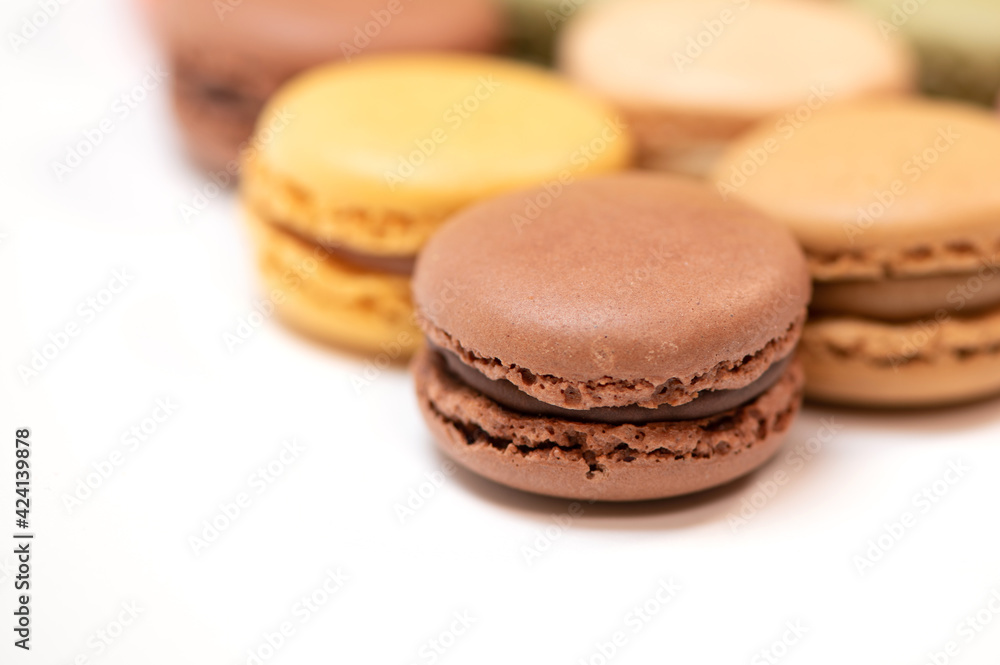 several multi-colored macaroon cakes on a white background several multi-colored macaroon cakes on a white background