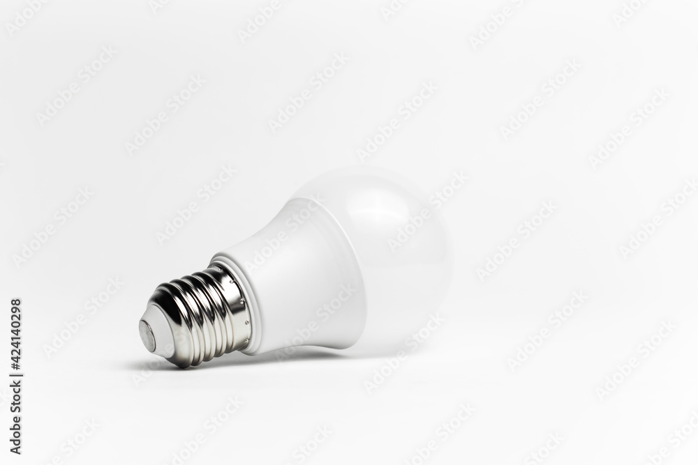 Close-up of eco light bulb isolated on white background. Minimalistic object concept. Close-up of eco light bulb isolated on white background. Minimalistic object concept.