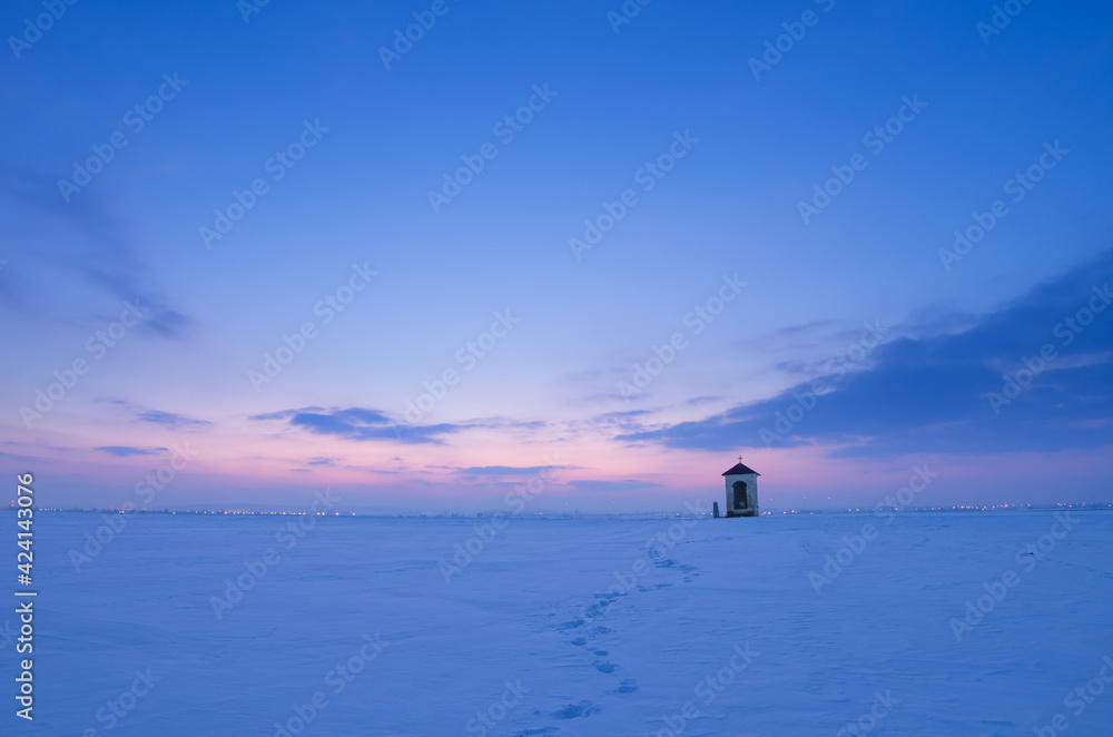 a chapel among the fields in winter