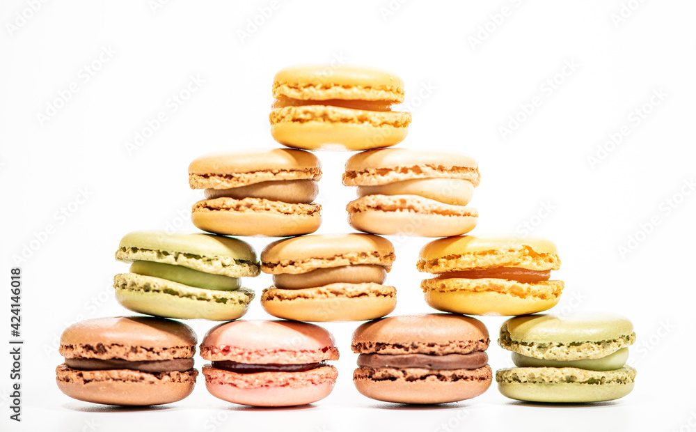 several multi-colored macaroon cakes on a white background several multi-colored macaroon cakes on a white background