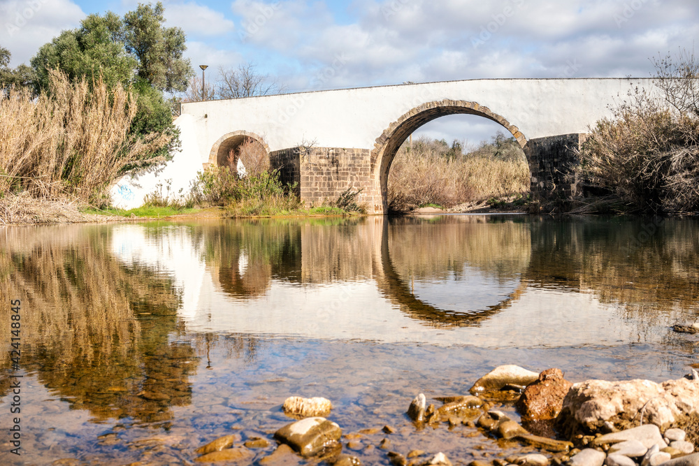 Fototapeta premium Roman bridge over a small river in Loule, Algarve, Portugal