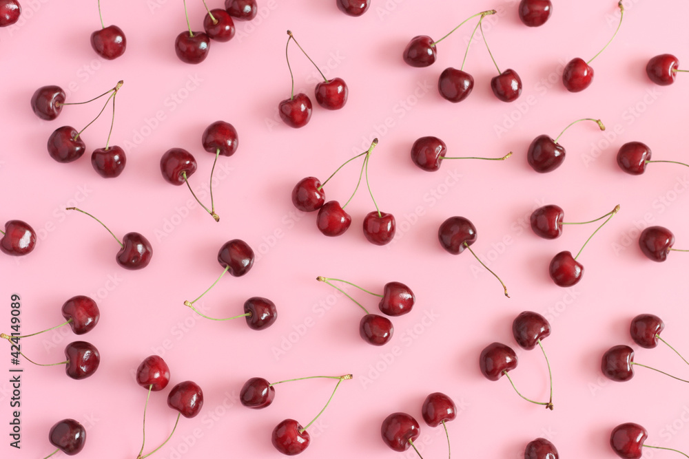 Sweet cherries on pastel pink background. Sweet cherries on pastel pink background.