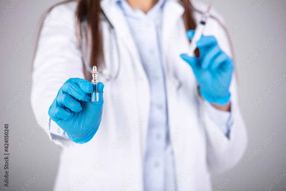 Syringe, medical injection in hand, palm or fingers. Medicine plastic vaccination equipment with needle. Nurse or doctor. Liquid drug or narcotic. Health care in hospital. Syringe, medical injection in hand, palm or fingers. Medicine plastic vaccination equipment with needle. Nurse or doctor. Liquid drug or narcotic. Health care in hospital.