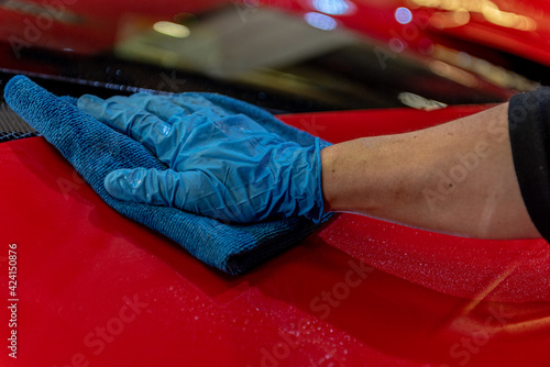 Wallpaper Mural Team washing a Ferrarri 488 in an artisanal way in Andorra in 2021 Torontodigital.ca