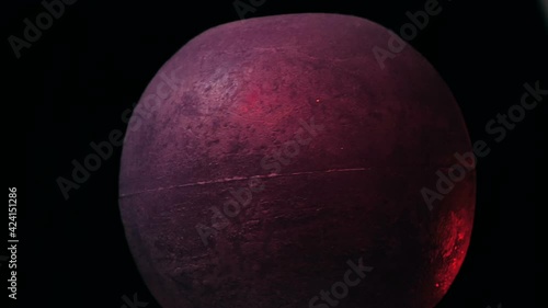 The planet Mars is flying in outer space. Close-up of the red planet is rotating in outer space. photo