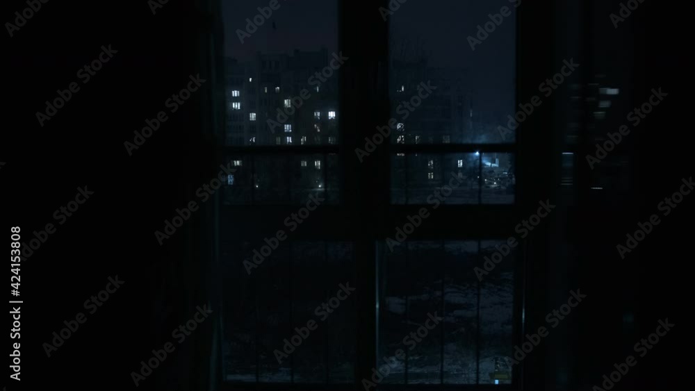 View of the night city from a panoramic window View of the night city from a panoramic window