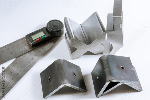 Sheet metal bending tool and equipment isolated on a white background. Electronic digital protractor. photo