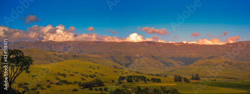 Panoramic Drakensberg mountain escarpment at sunset around Cathkin park in Kwazulu natal South Africa