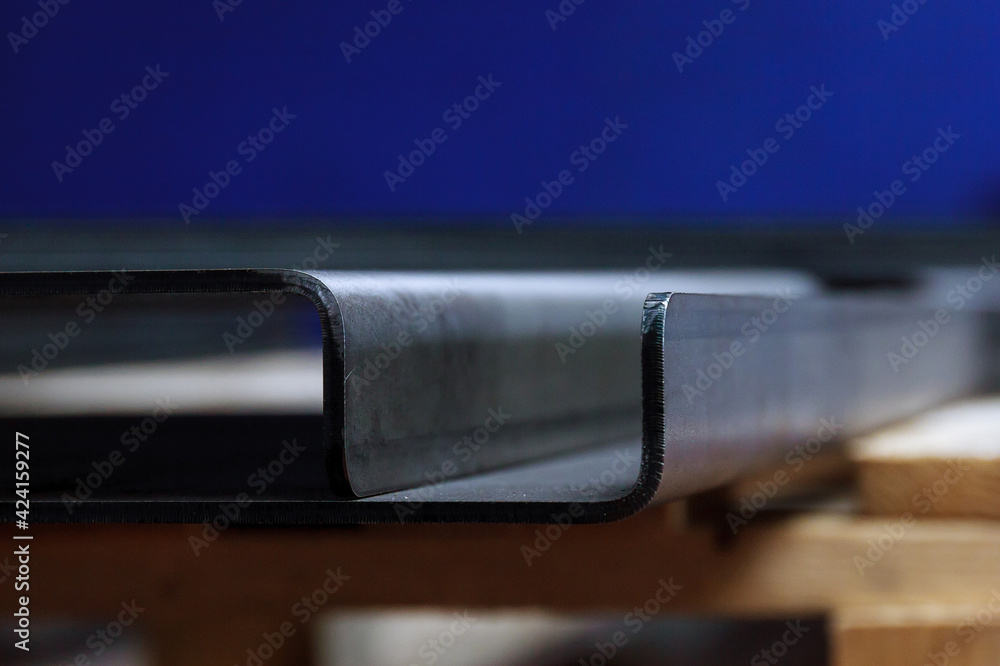 sheet metal product after processing on a bending machine. Precise bending of metal products - obrazy, fototapety, plakaty 