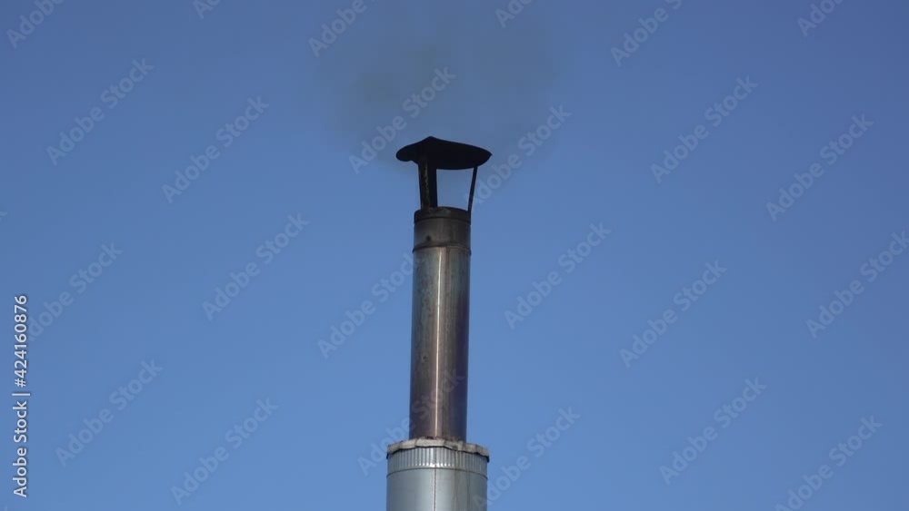 Smoke comes from a metal pipe located on the roof. Wood heating Smoke comes from a metal pipe located on the roof. Wood heating