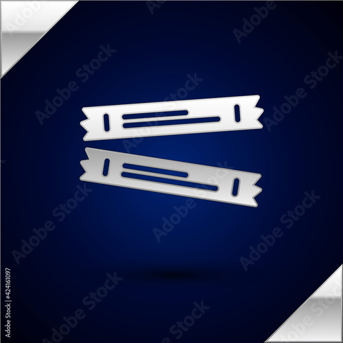Silver Sugar stick packets icon isolated on dark blue background. Blank individual package for bulk food products as coffee, salt, spices. Vector