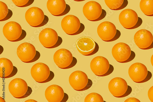 Fototapeta Naklejka Na Ścianę i Meble -  repeated orange on a yellow background