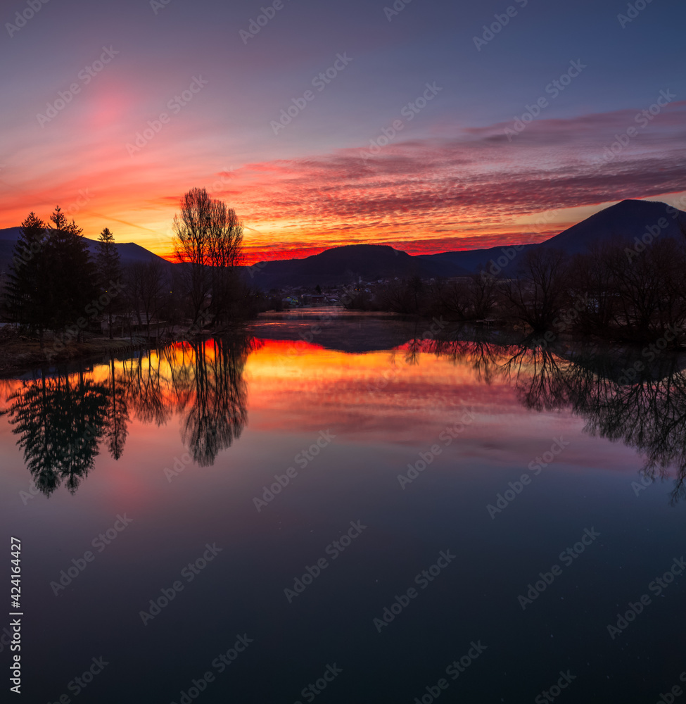 Naklejka premium sunrise over the river