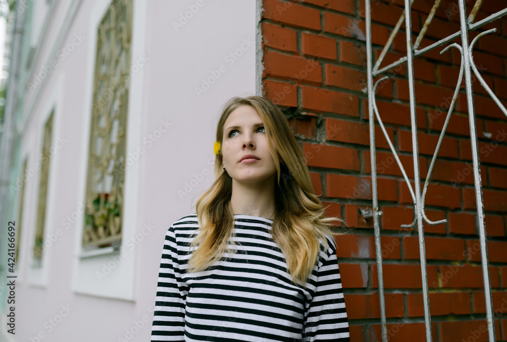 Portrait of beautiful young woman. She enjoys the sumertime.