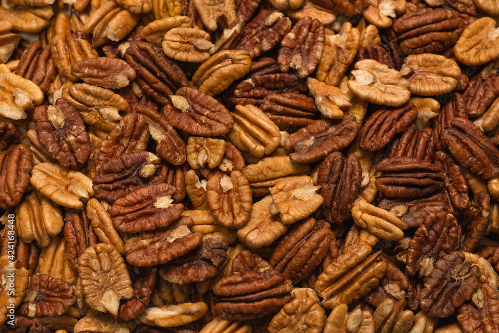 Tasty pecan-nut background. Top view. Tasty pecan-nut background. Top view.