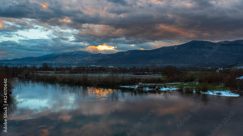 Obraz premium sunset over the river