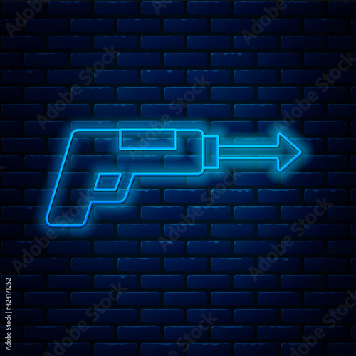 Glowing neon line Fishing harpoon icon isolated on brick wall background. Fishery manufacturers for catching fish under water. Diving underwater equipment. Vector