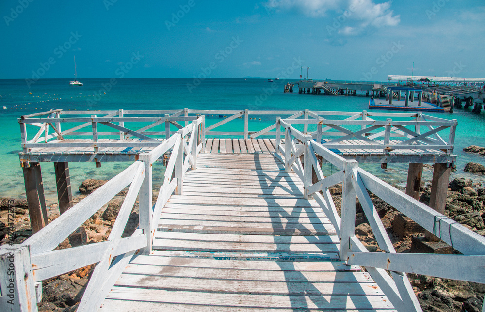 White wooden bridge at Sangwan Beach, Koh Larn, Pattaya, Thailand White wooden bridge at Sangwan Beach, Koh Larn, Pattaya, Thailand
