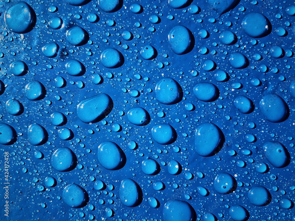 drops of water on blue wall