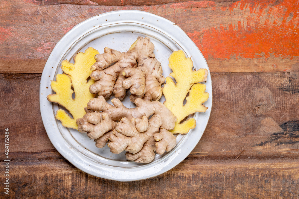 Fresh organic ginger roots, healthy food ingredient Fresh organic ginger roots, healthy food ingredient