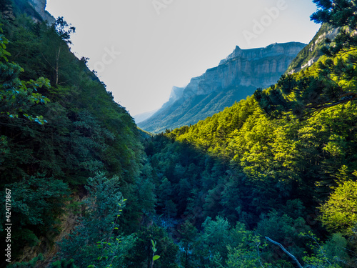 Luces y sombras en los bosques y laderas rocosas del Parque Nacional de Ordesa y Monte Perdido, en los Pirineos españoles photo