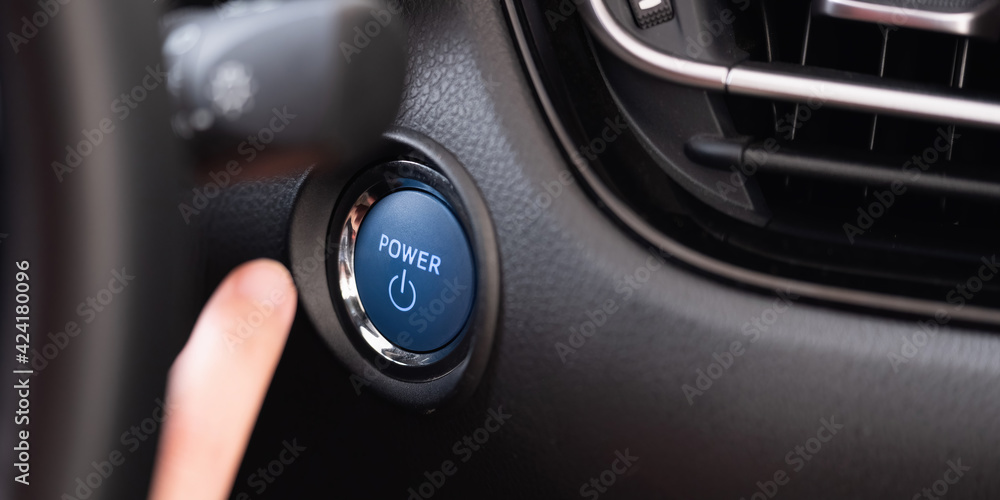 Woman Pushing An Engine Start Button, Ignition Switch Woman Pushing An Engine Start Button, Ignition Switch