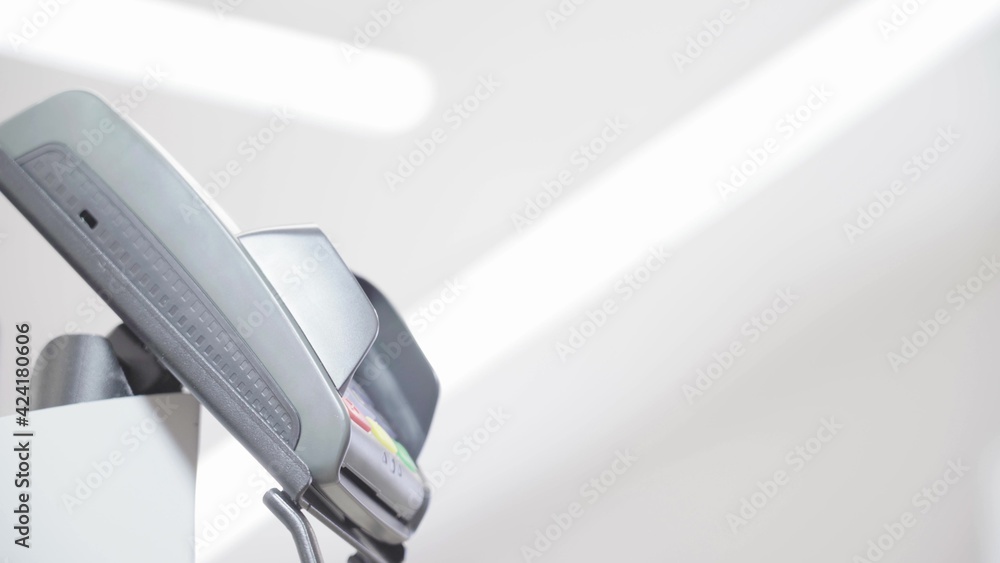 POS-Terminal on a Light Background in a Supermarket. Contactless Payment. blurry video. close-up POS-Terminal on a Light Background in a Supermarket. Contactless Payment. blurry video. close-up
