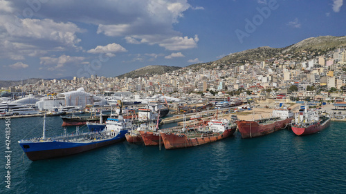 Aerial drone photo of industrial shipyards and ship repairs in Perama area next to island of Salamina, Attica, Greece