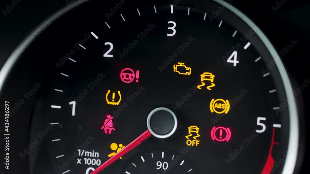 Many different car dashboard lights with warning lamps illuminated. Light symbol that pops up on dashboard when something goes wrong with the engine Many different car dashboard lights with warning lamps illuminated. Light symbol that pops up on dashboard when something goes wrong with the engine