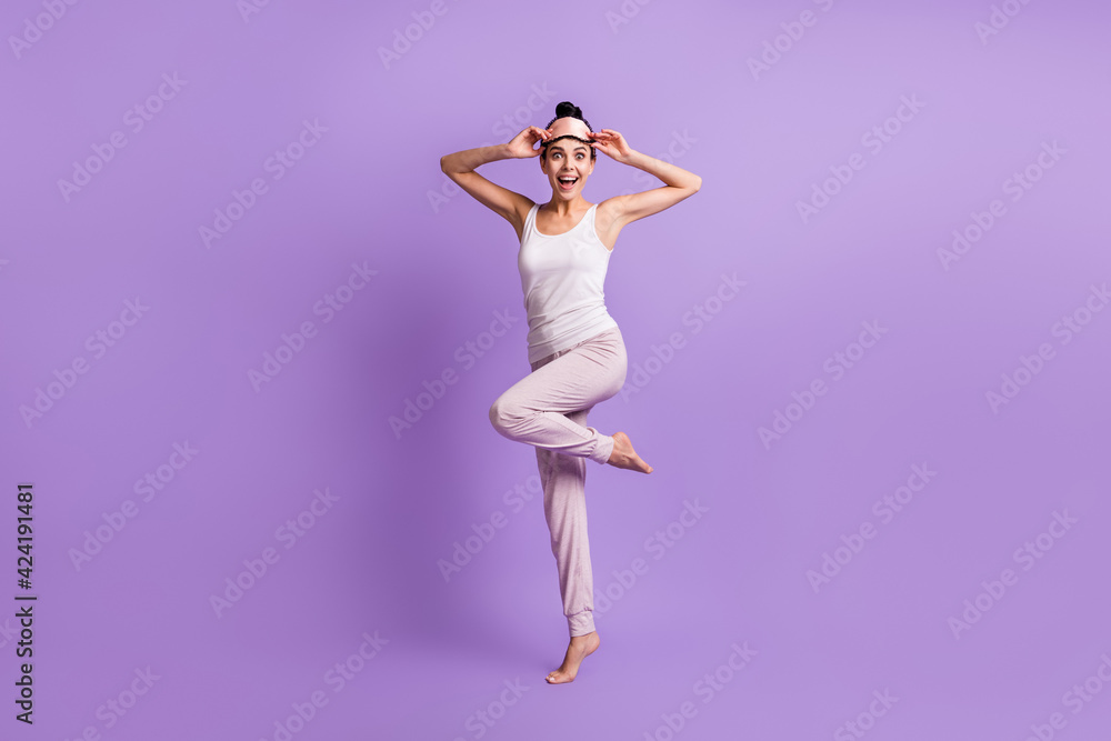 Full length body size photo of girl woke up in the morning staring smiling happy isolated pastel purple color background