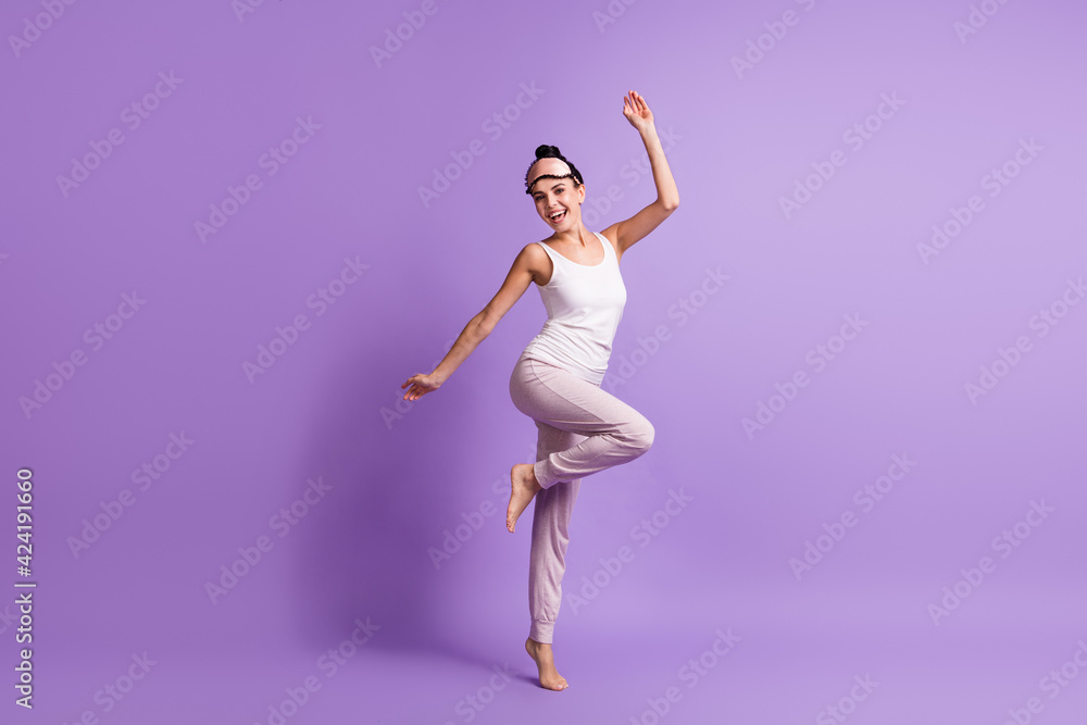 Full length body size photo of girl doing morning exercises smiling cheerful isolated pastel violet color background with copyspace Full length body size photo of girl doing morning exercises smiling cheerful isolated pastel violet color background with copyspace