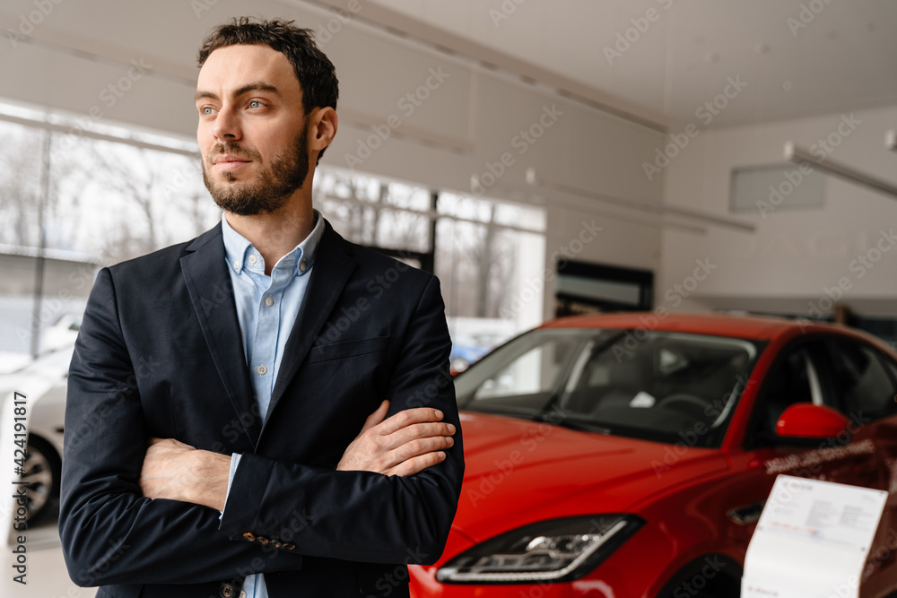 Close up of a mid aged man agent standing Close up of a mid aged man agent standing