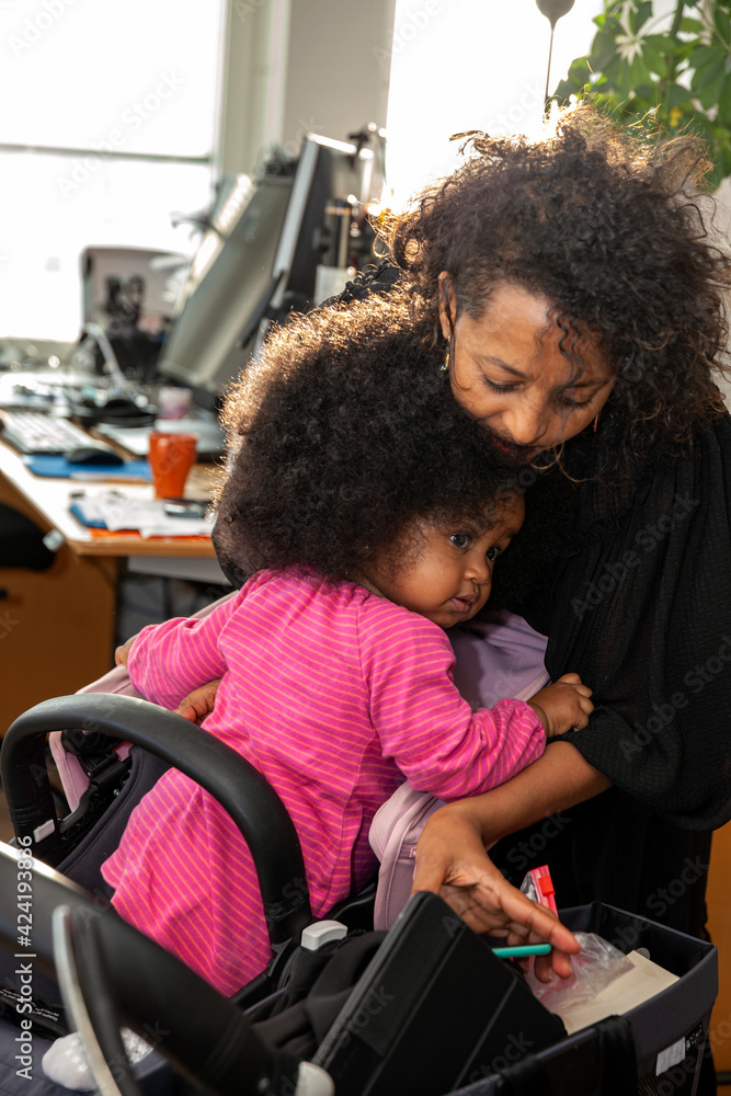 Mother with daughter in office Mother with daughter in office