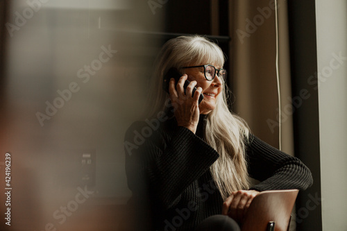 Senior woman using cell phone photo