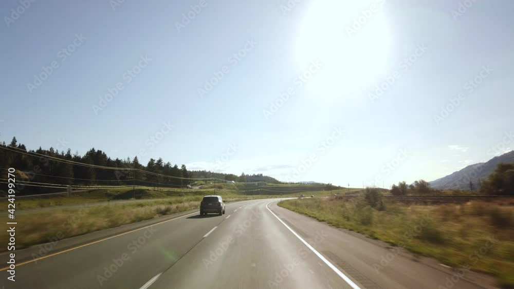 BC, CANADA- JULY 2019: Smooth & steady Driving on British Columbia highway during a sunny day