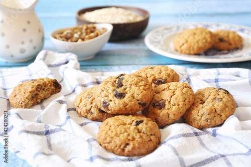 Homemade oatmeal cookies with raisins and walnuts photo