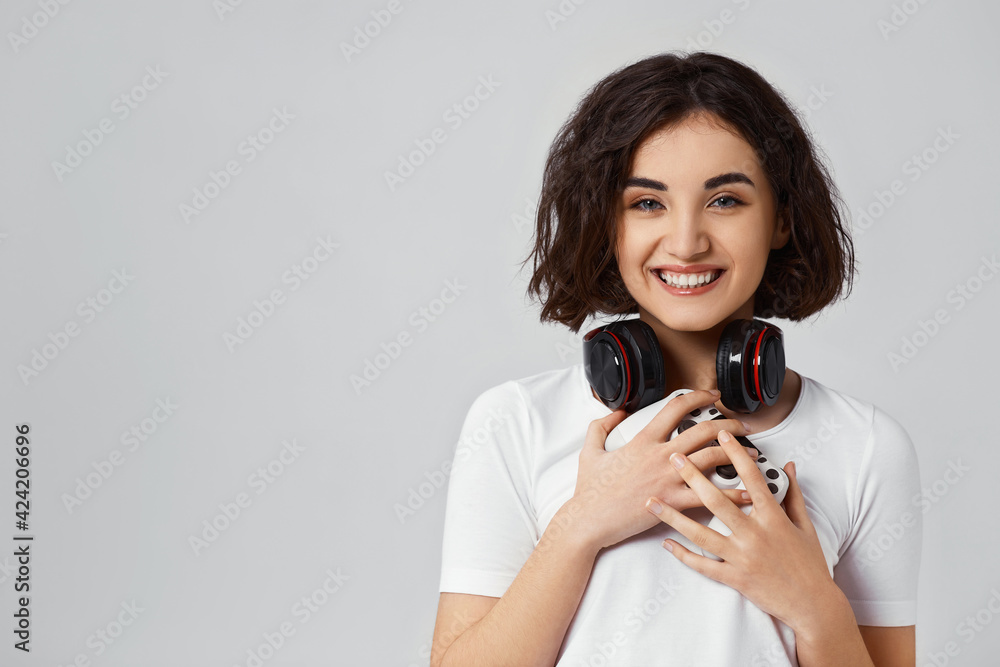 girl playing video games on gray background girl playing video games on gray background