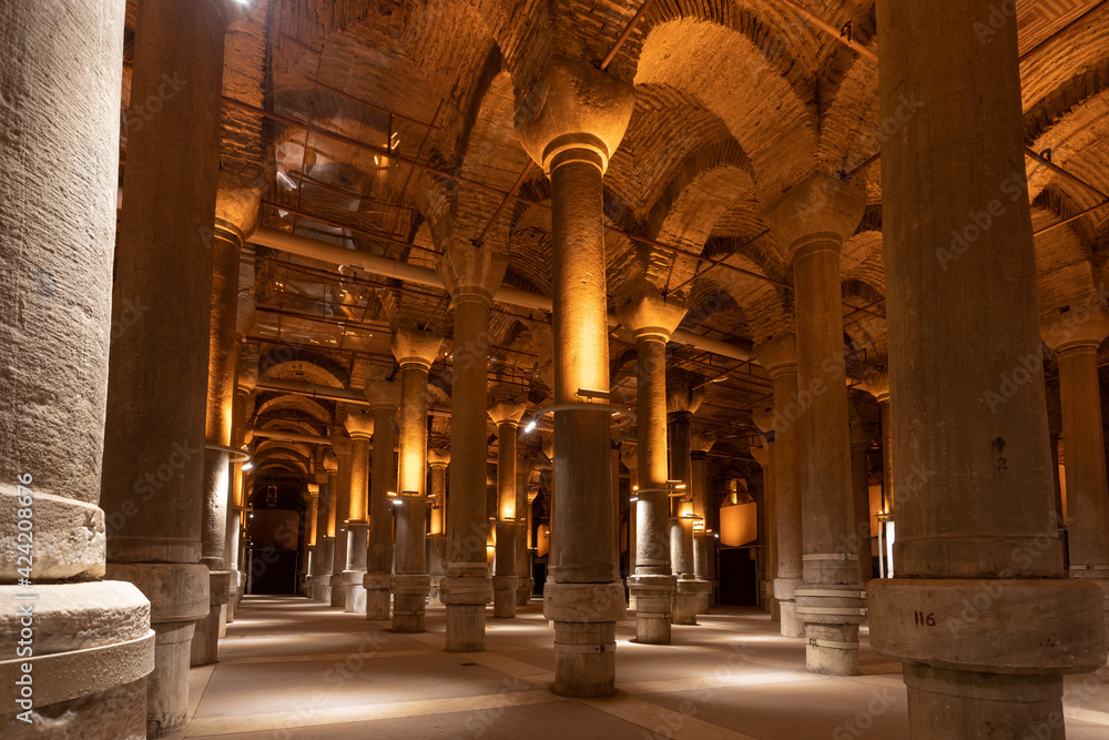 Istanbul, Turkey 3 March 2021. This is the interior of the Basilica Cistern. A lot of stone columns are installed to the ceiling, where they form arches. The columns are slightly lighted.