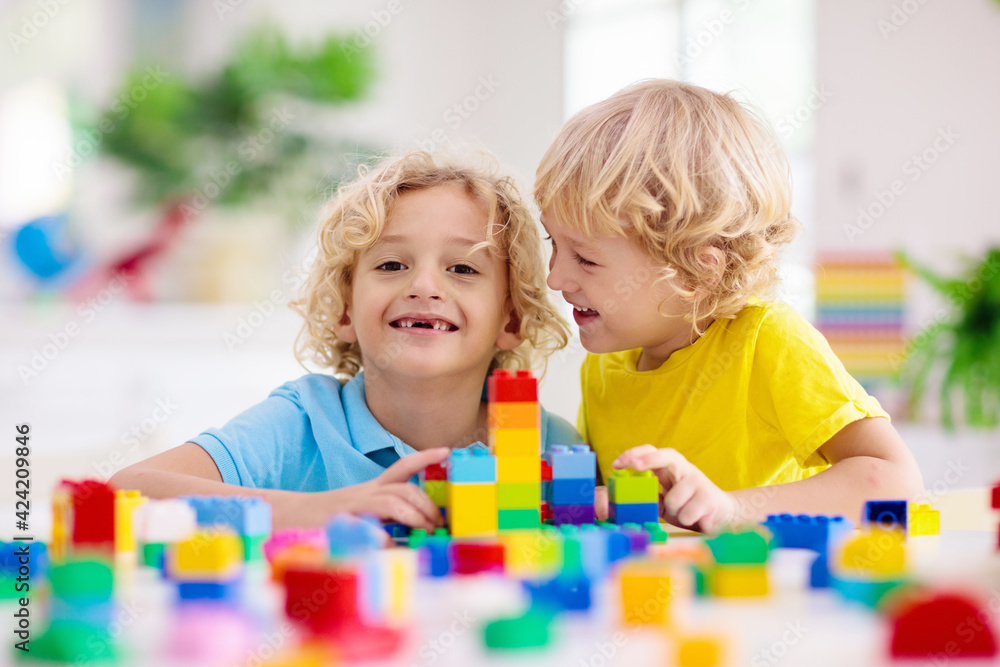 Child playing with toy blocks. Toys for kids. Child playing with toy blocks. Toys for kids.