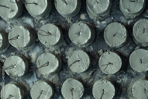 Close-up view of mortar spacer  arranged together on the floor as additional work is being done by the workers. Make a beautiful background