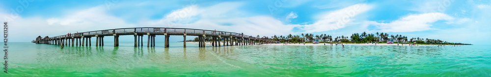 Tourists enjoying the Vanderbilt beach in Naples, Florida. Tourists enjoying the Vanderbilt beach in Naples, Florida.