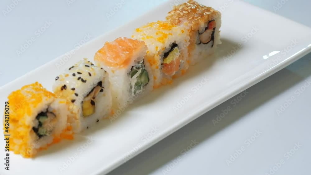 Sushi roll set on white background. Sushi Japanese food in restaurant. traditional background. Sushi roll set on white background. Sushi Japanese food in restaurant. traditional background.