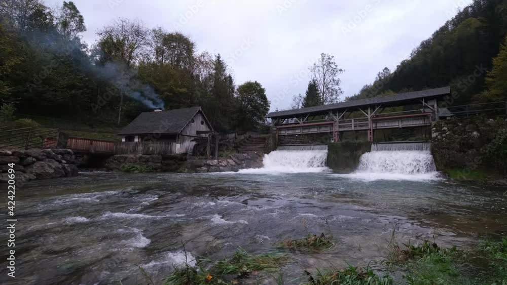 A dam and a beautiful old water mill, called Katzensteinermühle by the fast flowing Gaflenz River in Weyer, Steyr-Land, Upper Austria. Little touristic treasure in the mountains of the Alps. A dam and a beautiful old water mill, called Katzensteinermühle by the fast flowing Gaflenz River in Weyer, Steyr-Land, Upper Austria. Little touristic treasure in the mountains of the Alps.