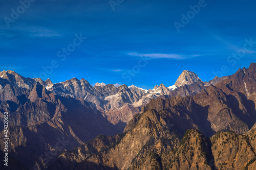 Mesmerizing view of Kamet, Parvati and Neelkanth mountains of Garhwal Himalayas from Kuari pass hiking trail near Auli, Uttarakhand, India.