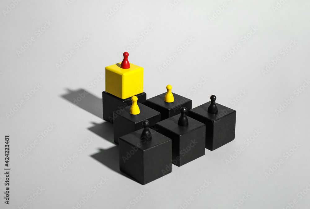 Cubes with game pieces on light grey background Cubes with game pieces on light grey background