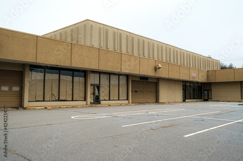 Empty parking lot by an abandoned department store. North Carolina.