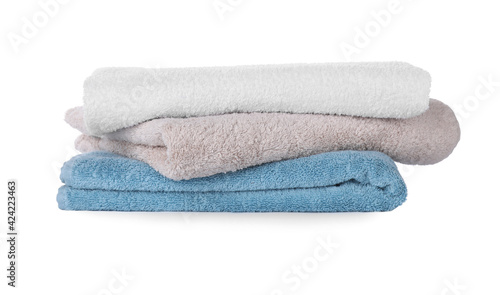Folded fresh clean towels on white background