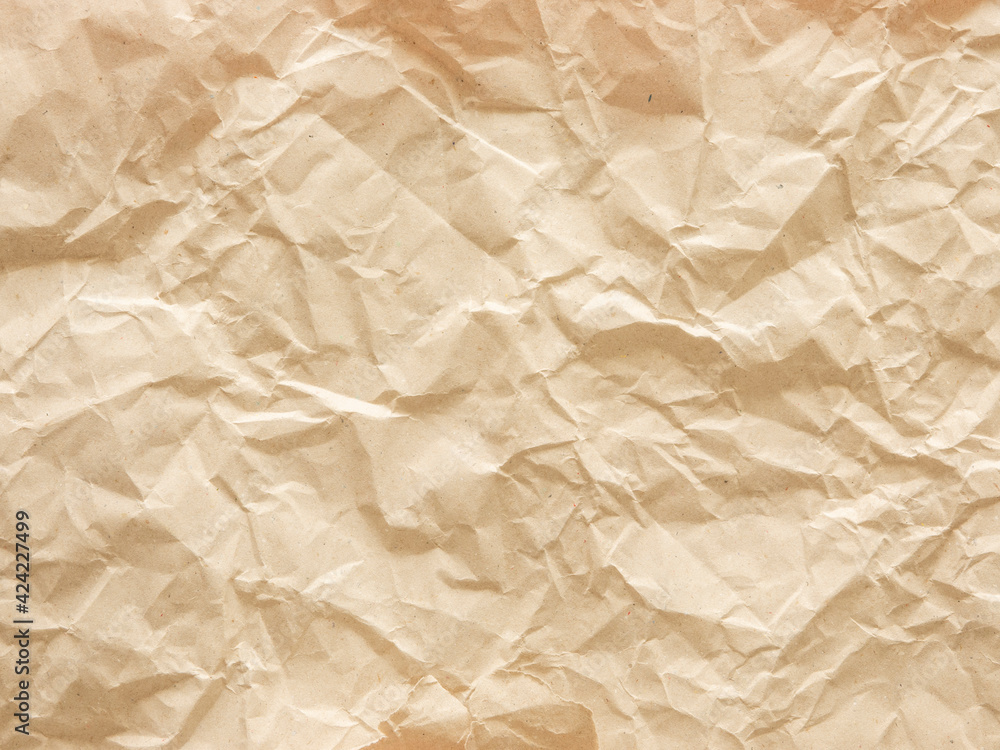 Obraz premium Crumpled recycled brown paper texture