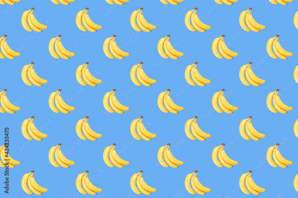 seamless pattern of bananas on light blue background
seamless pattern of bananas on light blue background
