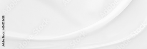 White gray satin texture that is white silver fabric silk panorama background with beautiful soft blur pattern natural.